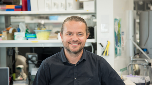 Dr. Sadikovic smiling in lab